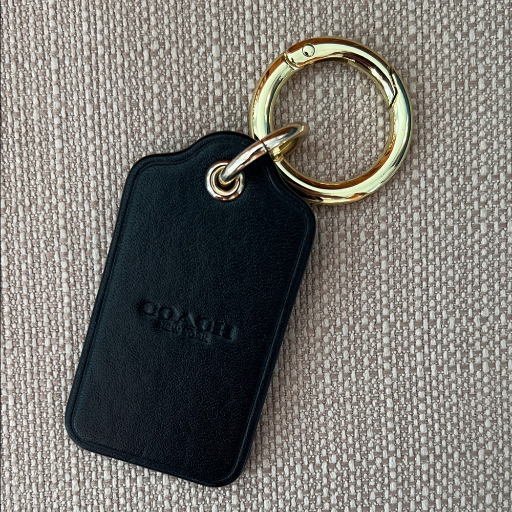Coach | Black Leather Accessory with Gold Ring